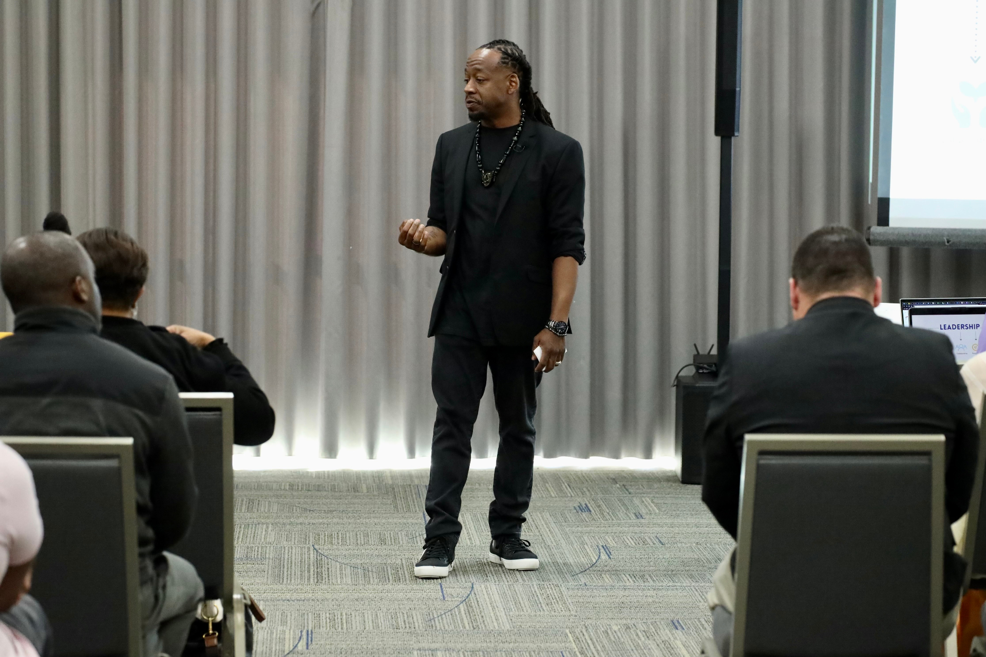 Tommy pointing at audience during keynote